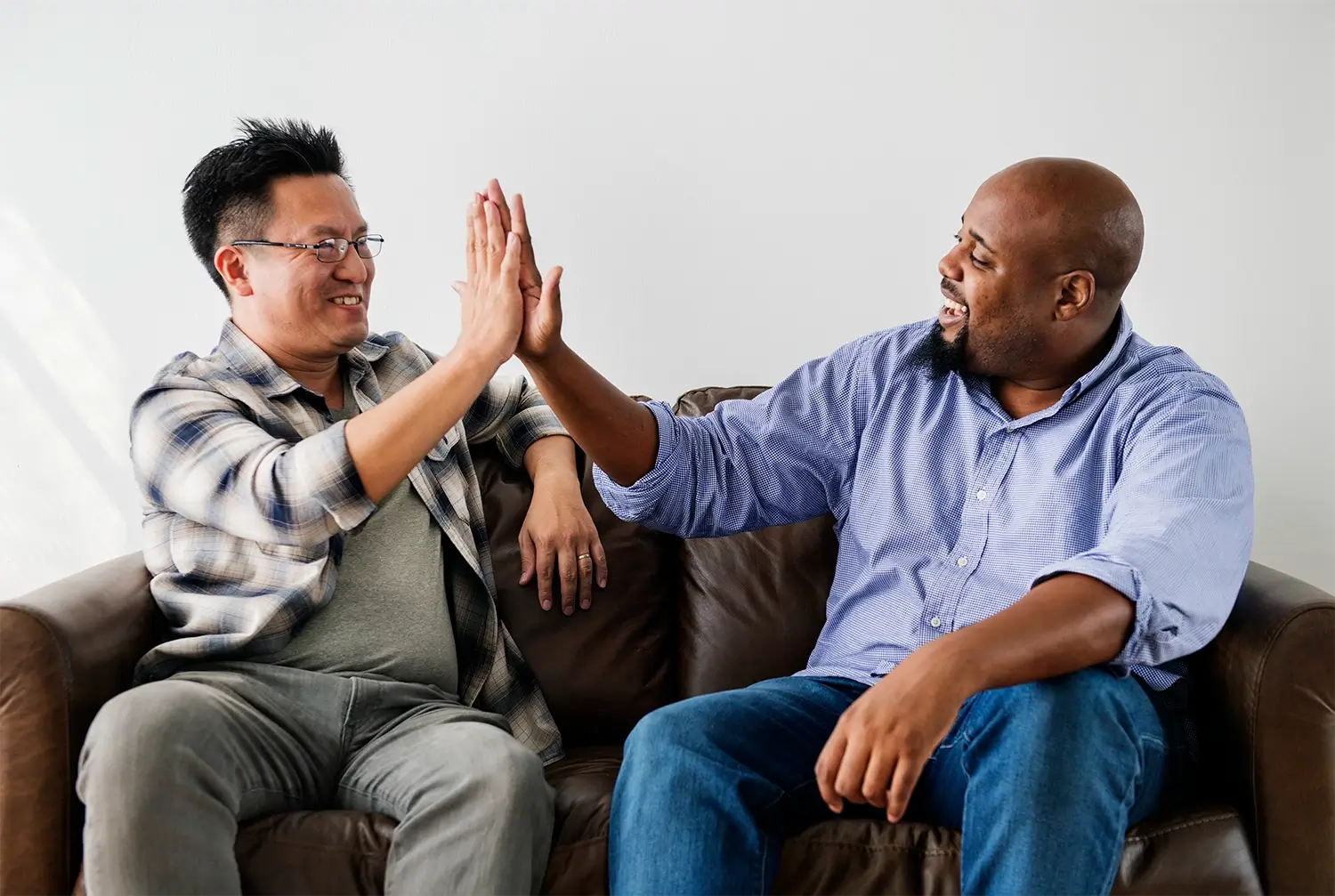 men-joining-hands-together